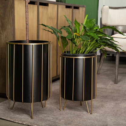 BLACK METAL PLANT STAND IN BRASS FRAME